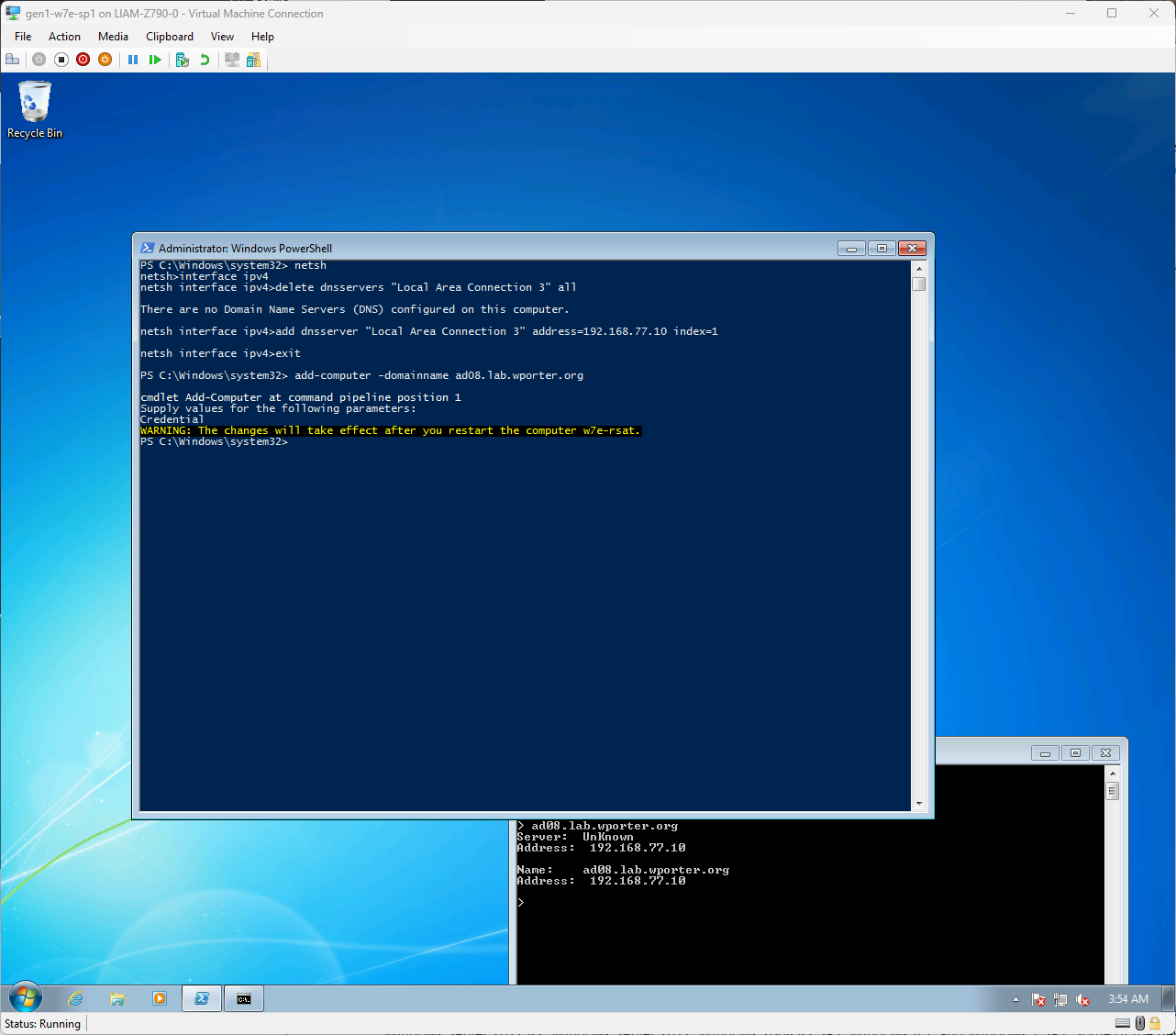 A screenshot of a Windows 7 desktop showing a successful Add-Computer cmdlet and a reboot prompt