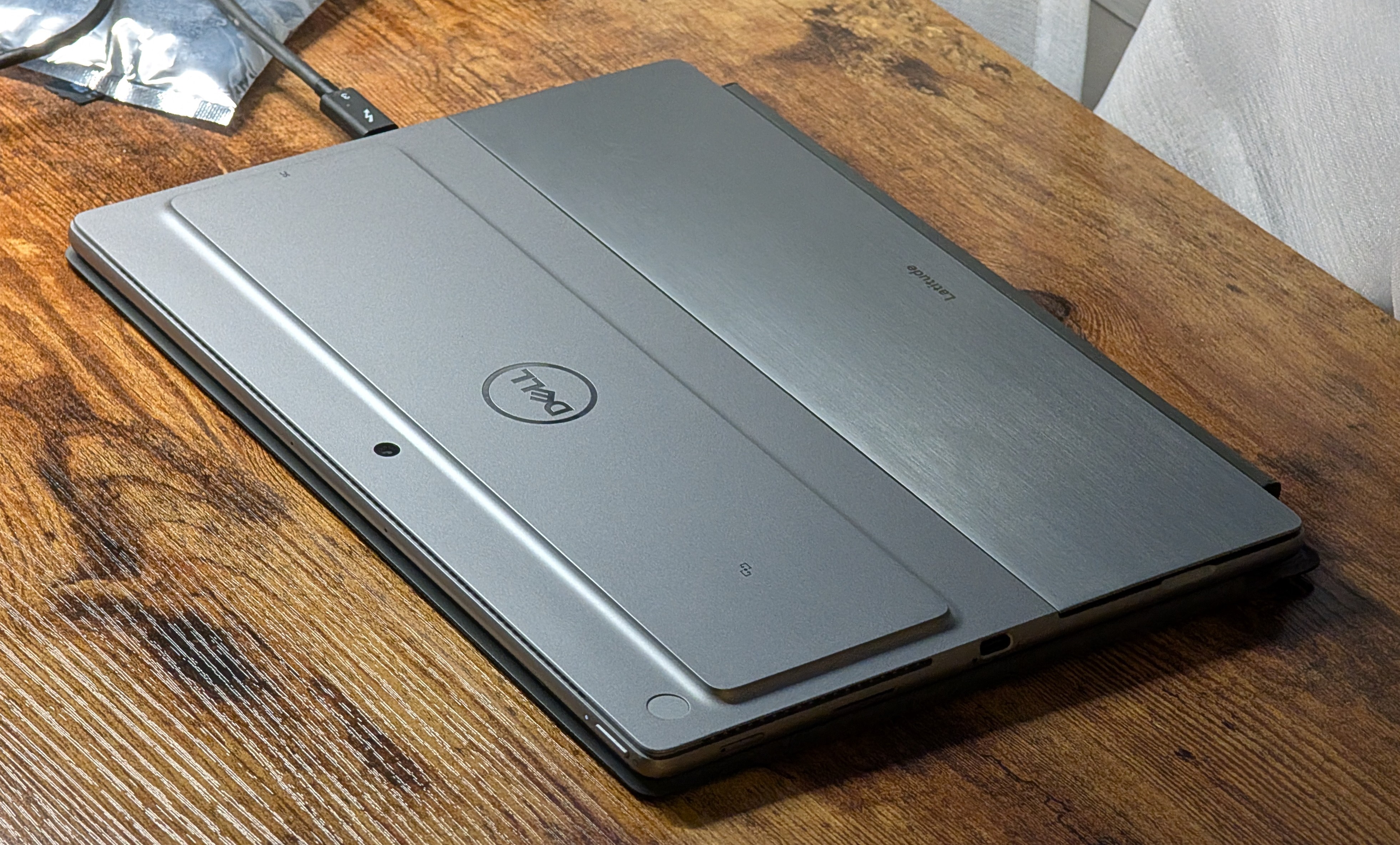 The 7320 sitting on a table, closed, displaying the rear of the device