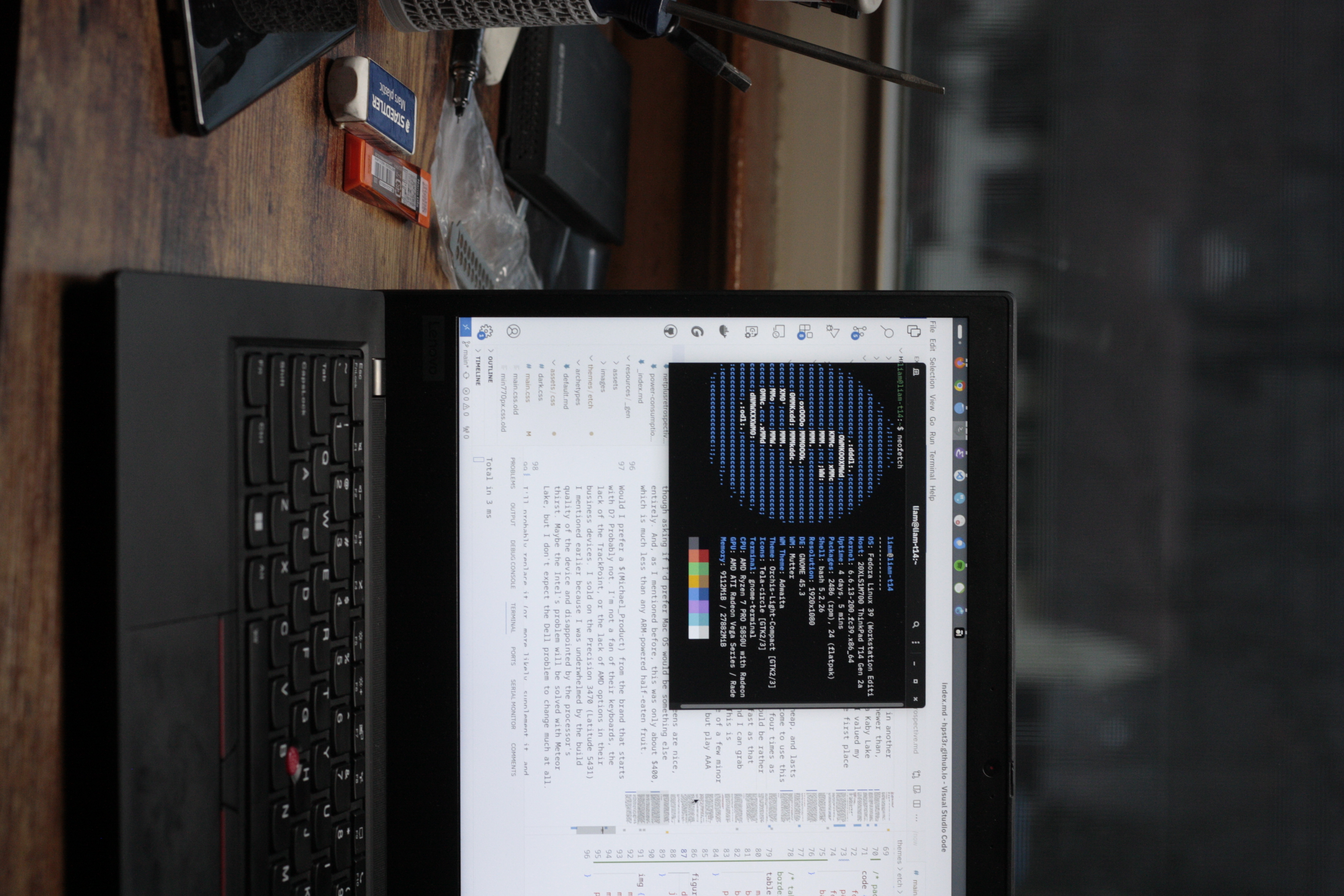 T14 with Neofetch in a Gnome Terminal window, VSCode in background showing this page's source